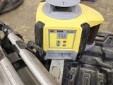 a yellow and black machine that is sitting on the ground