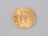 a gold coin with a picture of a woman on it