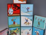 many different tin lunch boxes stacked on top of each other