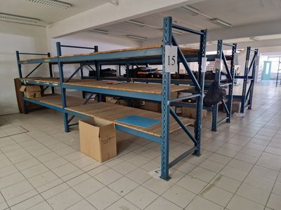 a room with a lot of shelves and boxes on the floor