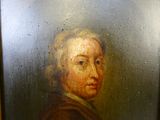 portrait d'un homme vêtu d'un manteau marron à col blanc