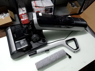 a black and white blow dryer sitting on a table