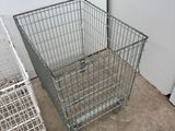 two baskets sitting next to each other on the floor