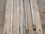 a wooden pallet that has a bunch of pipes on top of it