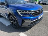 a blue suv that is parked in a parking lot