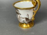 an image of a coffee cup with a picture of a house on it