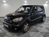 a picture of a black suv parked in a garage