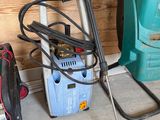 a picture of a pressurer and a vacuum in a garage