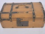 an old suitcase that is sitting on a white surface
