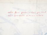 a graffiti on the wall of a building with writing on it