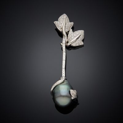 a black pearl and diamond broochle