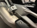 a close up of a motorcycle seat with a metal handle