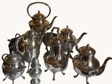 silver plated tea and coffee set with teapots and saucers