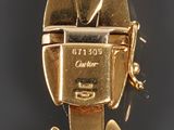 a close up of a gold plated watch on display