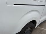 a white van that is parked in a parking lot