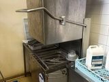 a kitchen with a stove, sink, and a dishwasher