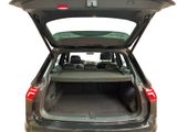 the back of a car with its trunk open and the back seats folded down