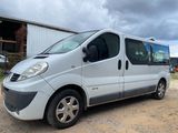 a picture of a silver van parked in a lot