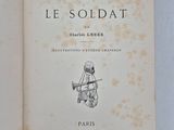 an open book with a drawing of a soldier on it