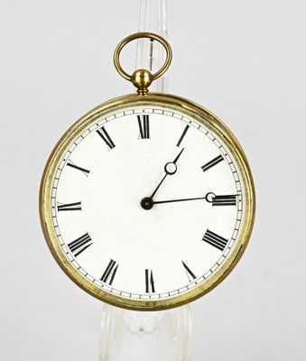 a gold clock with roman numerals on the face