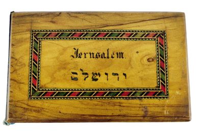 an old wooden box with hebrew writing on it