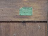 a sign on a wooden door that says tototot