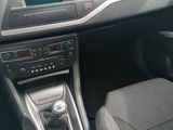 a dashboard of a car with a steering wheel and dashboard controls