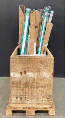 a wooden crate with a bunch of pens and pencils in it