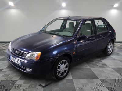 a picture of a blue car parked in a garage