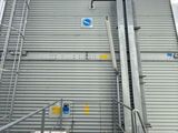 a metal staircase going up to the top of a building