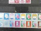 many different stamps on display in a glass case