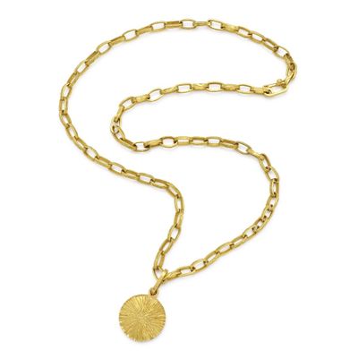 a gold necklace with a chain and a coin on a white background