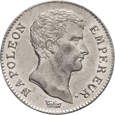 a close up of a coin with a man ' s face on it