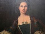 portrait of a woman in a green dress and a brown shawl