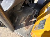 a close up view of the front end of a yellow tractor