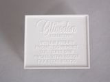 a white business card on a white surface