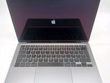 a close up of a laptop computer on a white surface