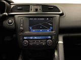the dashboard of a car with a radio and a steering wheel
