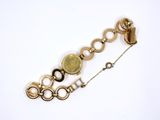 an image of a close up of a bracelet on a white surface