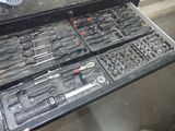 a drawer full of tools sitting on a table