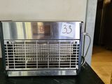 a toaster that is on a counter in a kitchen