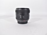 a close up of a camera lens on a white surface