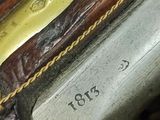 a close up of a gun on display on a table