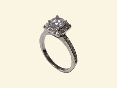 a close up of a diamond ring on a white background