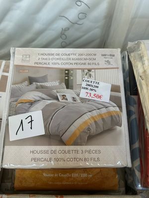 boxes of bedding and pillows for sale in a store