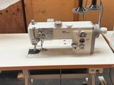 a sewing machine sitting on a table in a room