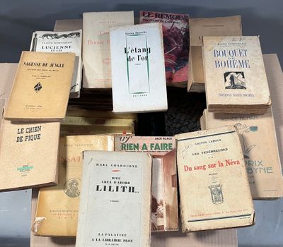 a lot of books that are sitting on a table