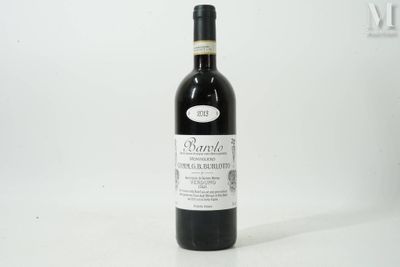a bottle of wine that is sitting on a table