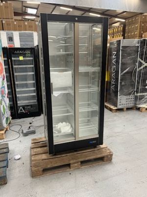 a refrigerator that is sitting on a pallet in a warehouse