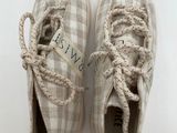 a close up of a pair of shoes on a white surface